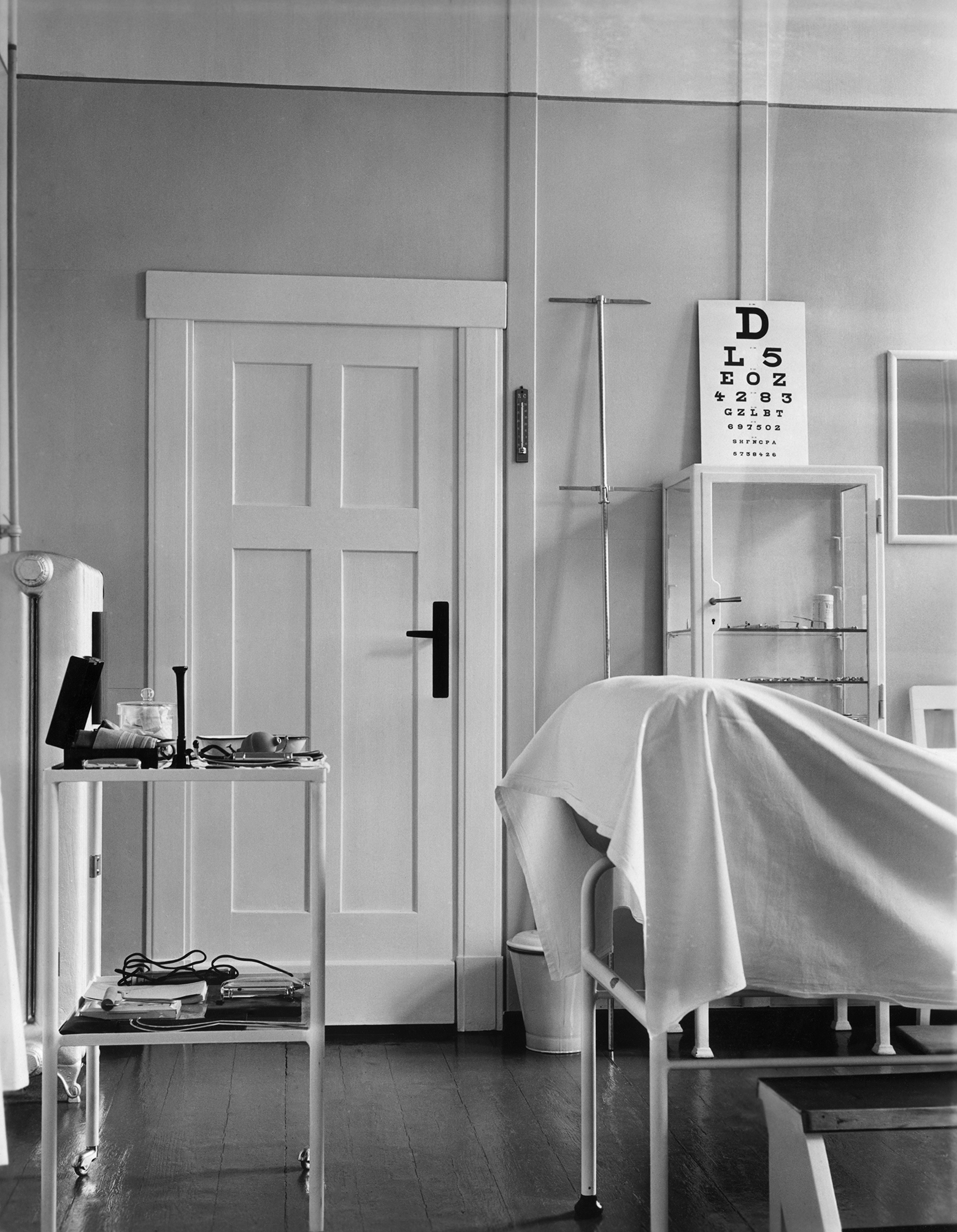 The second is an interior view of an examination room painted in light colors.